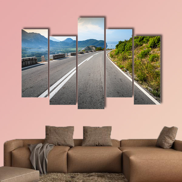 Turning mountain highway with sky and sea on a background wall art