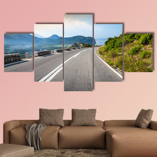 Turning mountain highway with sky and sea on a background wall art