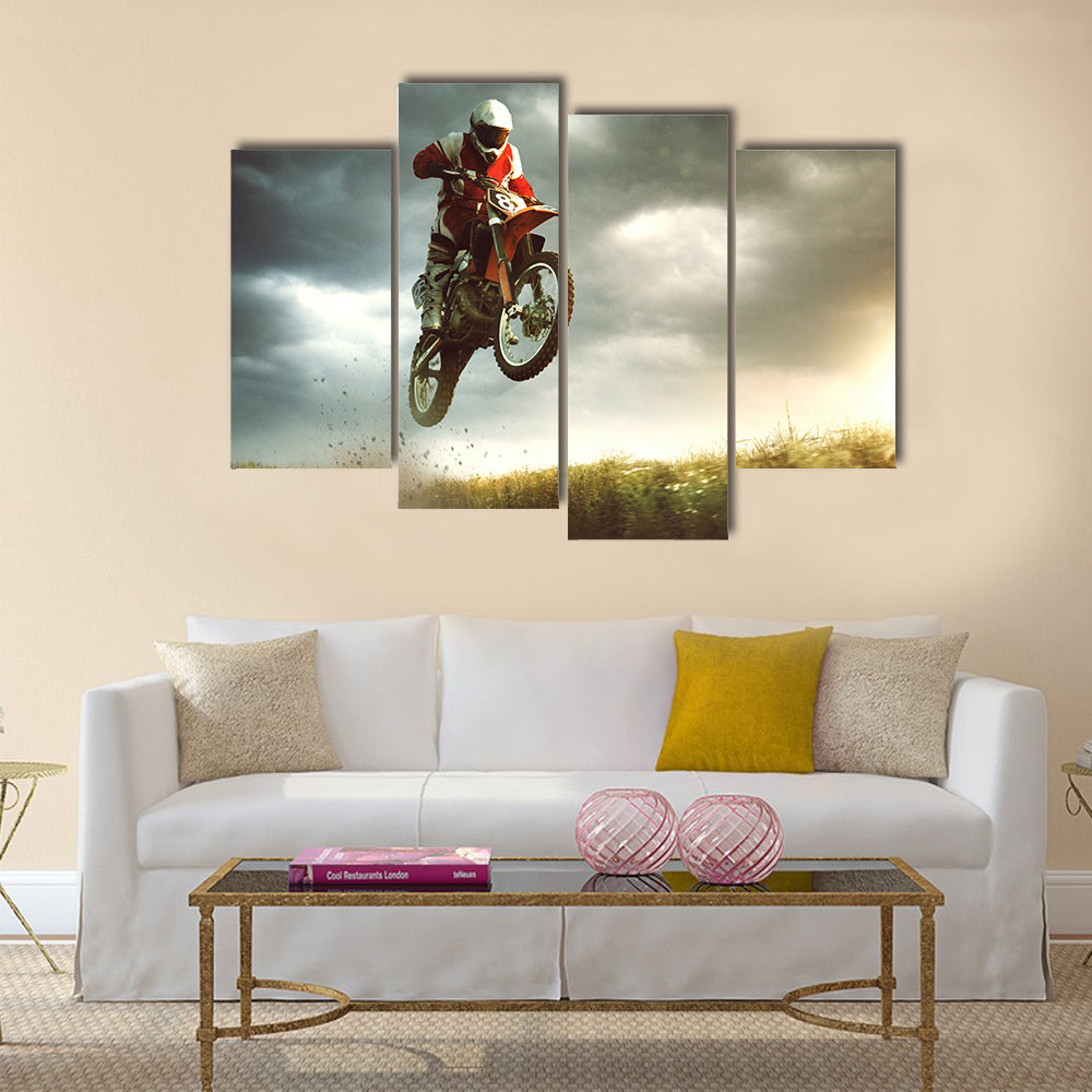 A canvas of a biker making a stunt and jumps in the air Multi panel canvas wall art