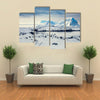 Beautiful snow-capped mountains against the blue sky in Antarctica Multi panel canvas wall art