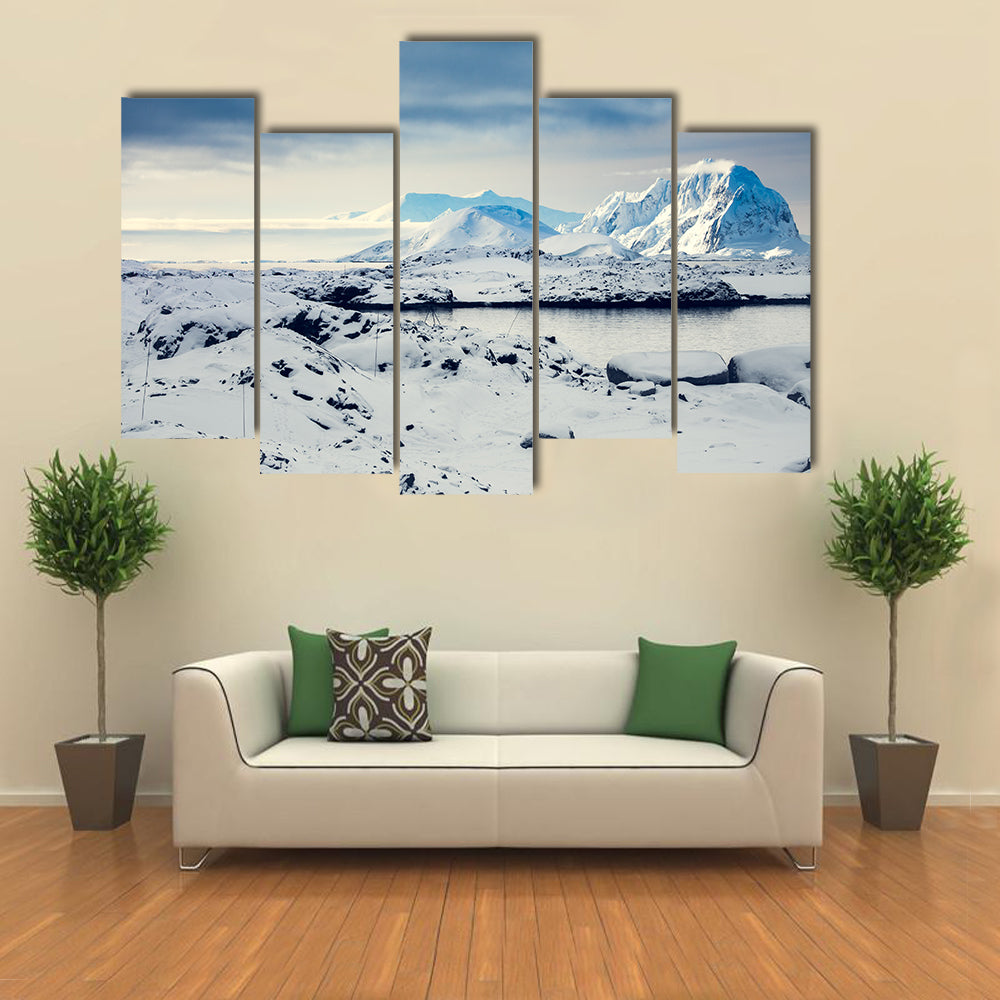 Beautiful snow-capped mountains against the blue sky in Antarctica Multi panel canvas wall art