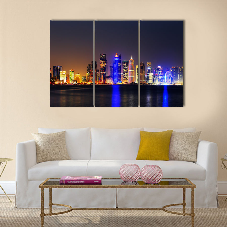 Doha, Qatar at Dusk is a beautiful city skyline of impressive contemporary architecture Multi panel canvas wall art