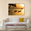 Sunset with palm on tropical beach. multi panel canvas wall art