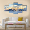 Alpine landscape with peaks covered by snow and clouds Multi panel canvas wall art