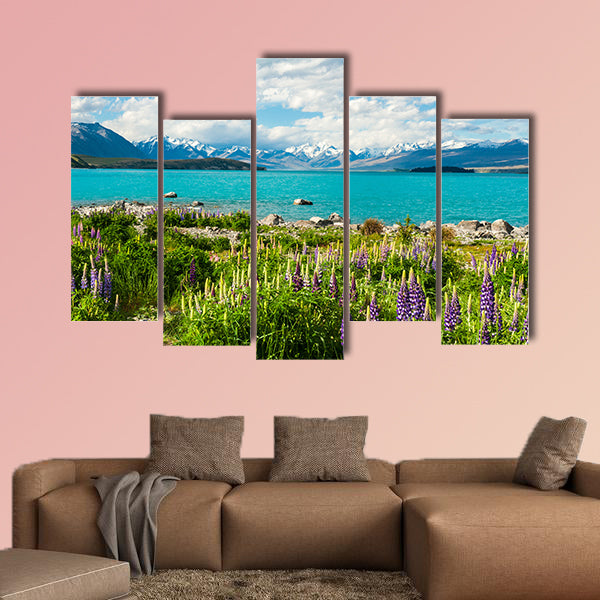 Beautiful incredibly blue Lake Tekapo with blooming lupins multi panel canvas wall art