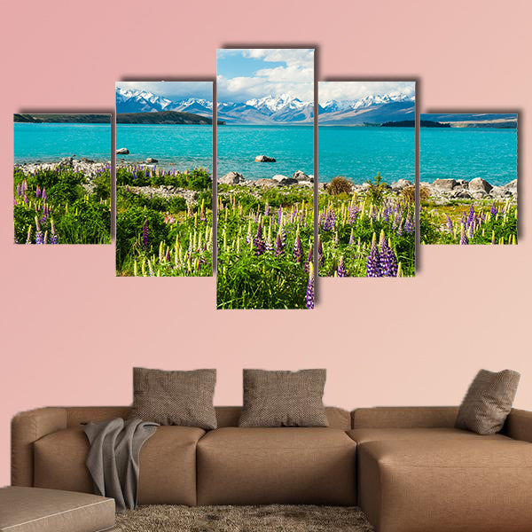 Beautiful incredibly blue Lake Tekapo with blooming lupins multi panel canvas wall art