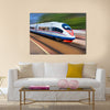 Beautiful photo of high speed modern commuter train Multi panel canvas wall art