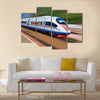 Beautiful photo of high speed modern commuter train Multi panel canvas wall art