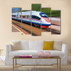 Beautiful photo of high speed modern commuter train Multi panel canvas wall art