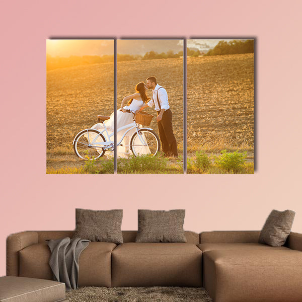 Beautiful bride and groom wedding portrait with white bike wall art