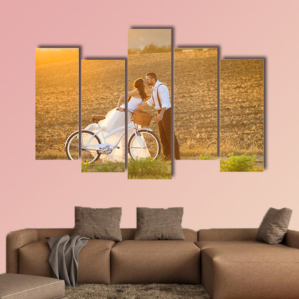 Beautiful bride and groom wedding portrait with white bike wall art