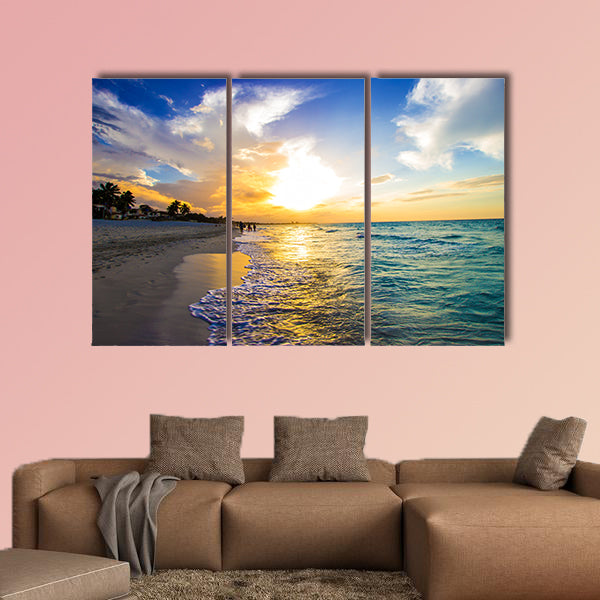 Sandy beach with the ocean at sunset Multi panel canvas wall art