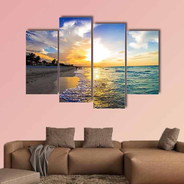 Sandy beach with the ocean at sunset Multi panel canvas wall art