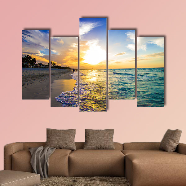 Sandy beach with the ocean at sunset Multi panel canvas wall art