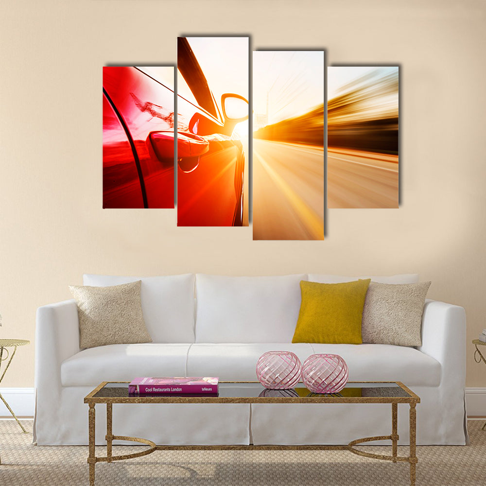 A red car driving on a motorway at high speeds, overtaking other cars Multi panel canvas wall art
