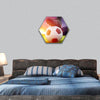 Football or soccer ball at kickoff of a game with sunset hexagonal canvas wall art