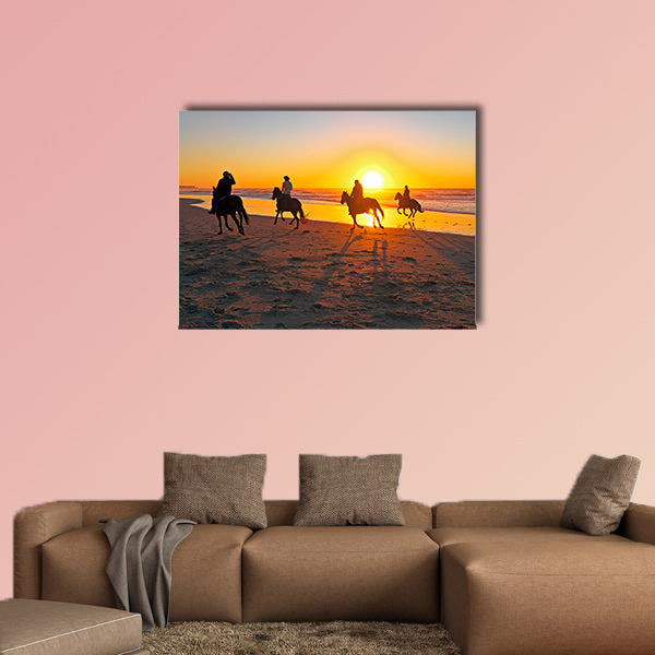 Horse riding on the beach at sunset multi panel canvas wall art