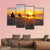 Horse riding on the beach at sunset multi panel canvas wall art