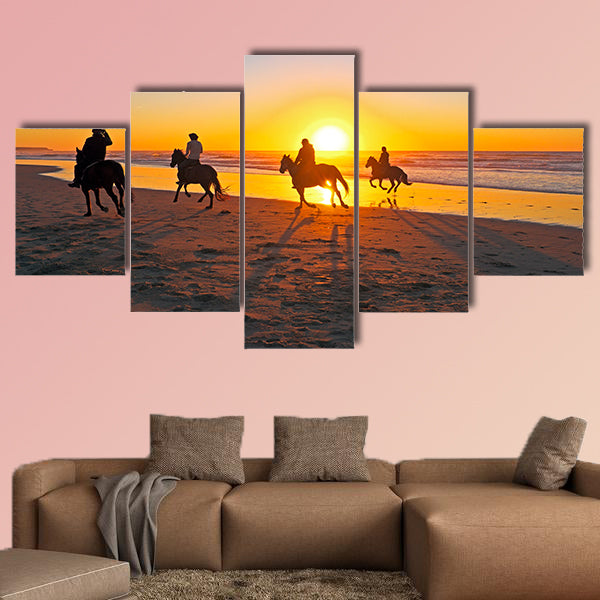 Horse riding on the beach at sunset multi panel canvas wall art