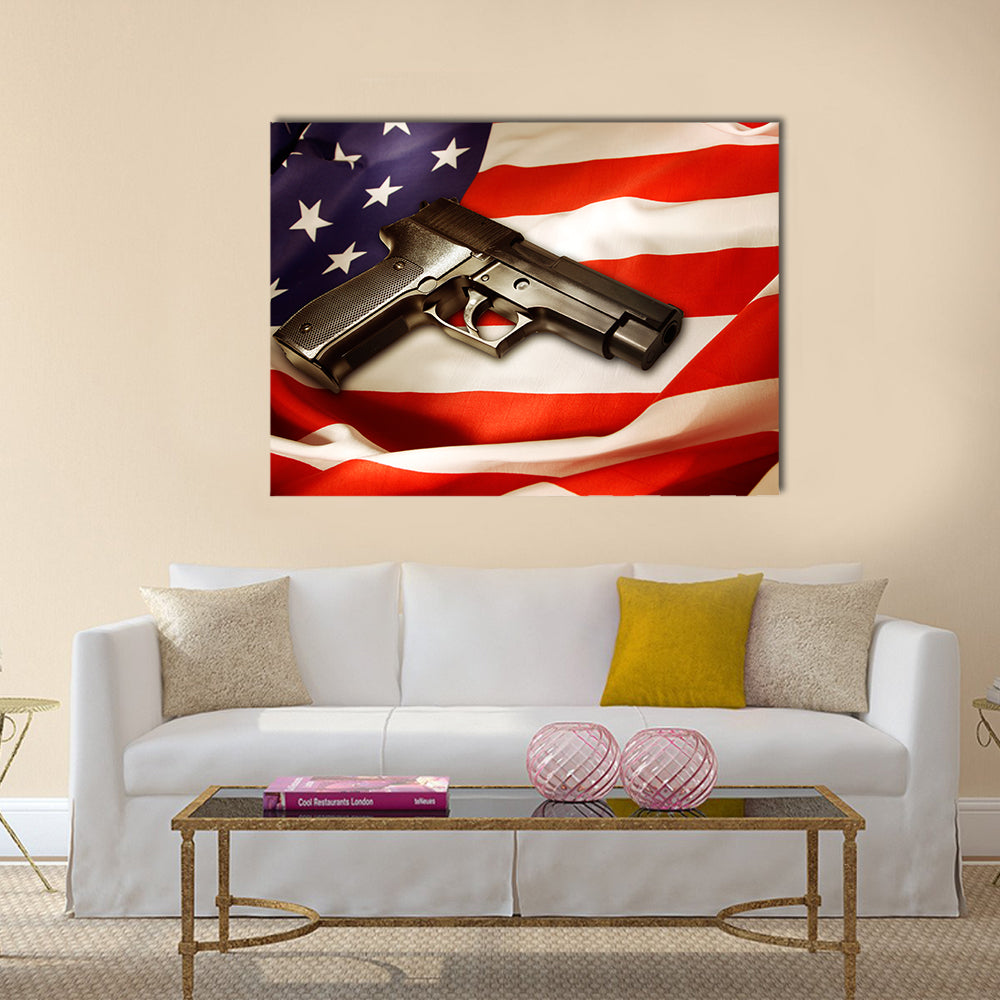 Handgun lying on American flag multi panel canvas wall art