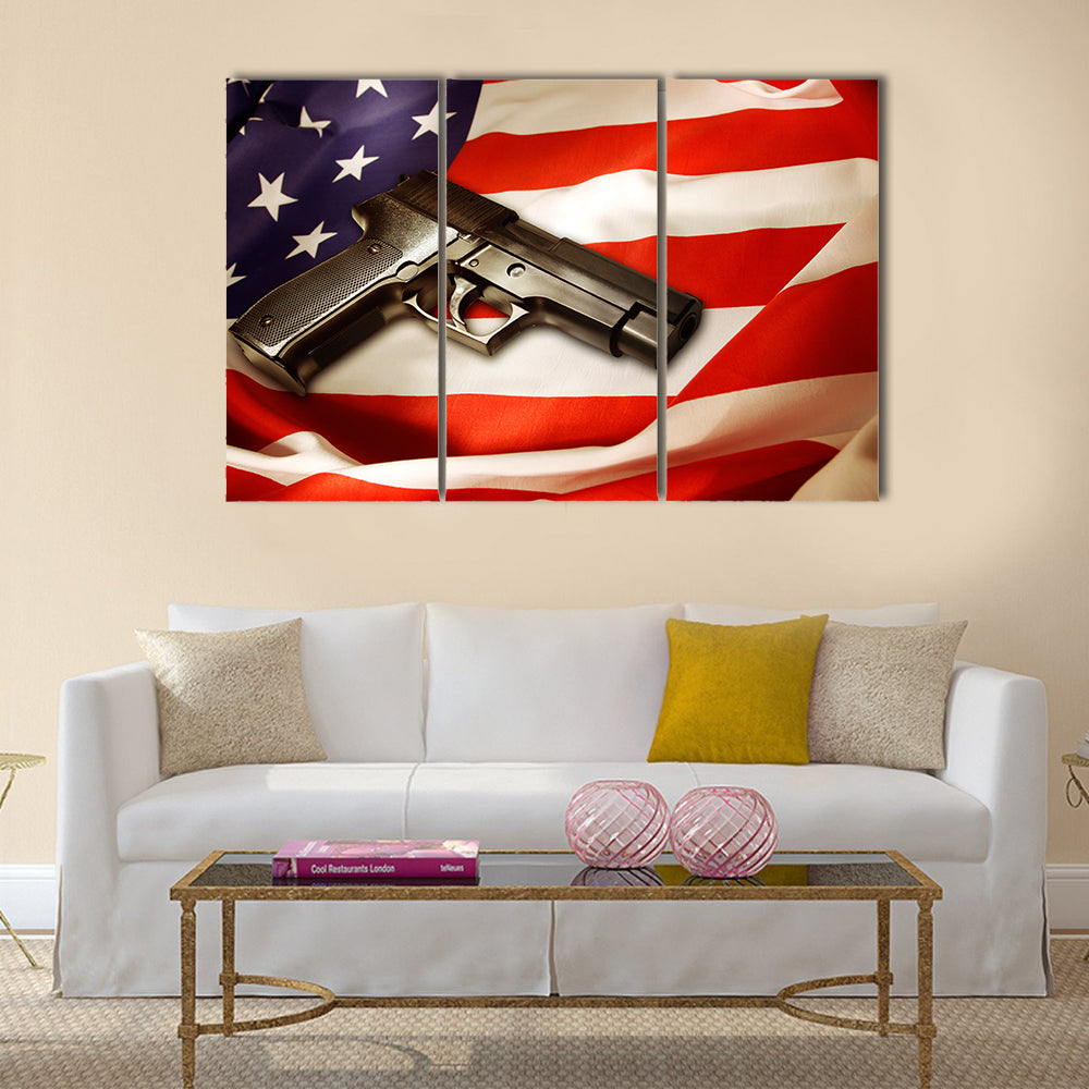 Handgun lying on American flag multi panel canvas wall art