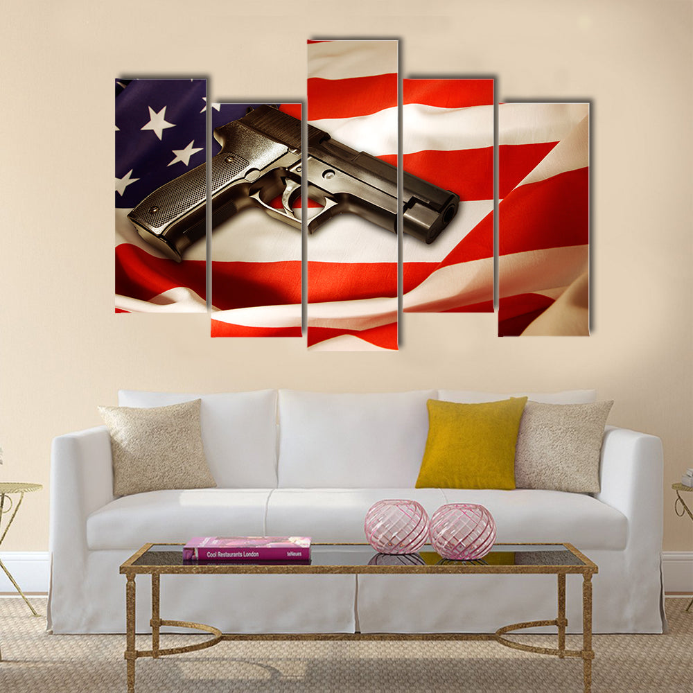 Handgun lying on American flag multi panel canvas wall art