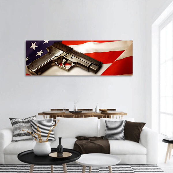 Handgun lying on American flag panoramic canvas wall art