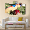 Cricket ball, bat and gloves on the field Multi panel canvas Wall art