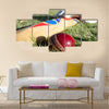 Cricket ball, bat and gloves on the field Multi panel canvas Wall art