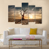 Lonely dead tree under dramatic evening sunset sky Multi panel canvas wall art