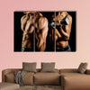 Bodybuilding Strong man and a woman posing on a black background Multi panel canvas wall art