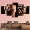 Bodybuilding Strong man and a woman posing on a black background Multi panel canvas wall art