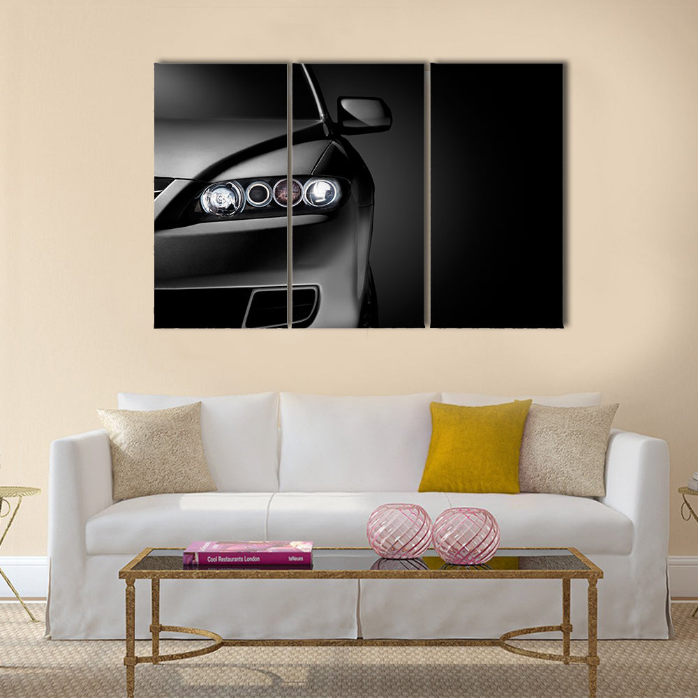 Gray modern car closeup on black background Multi panel canvas wall art