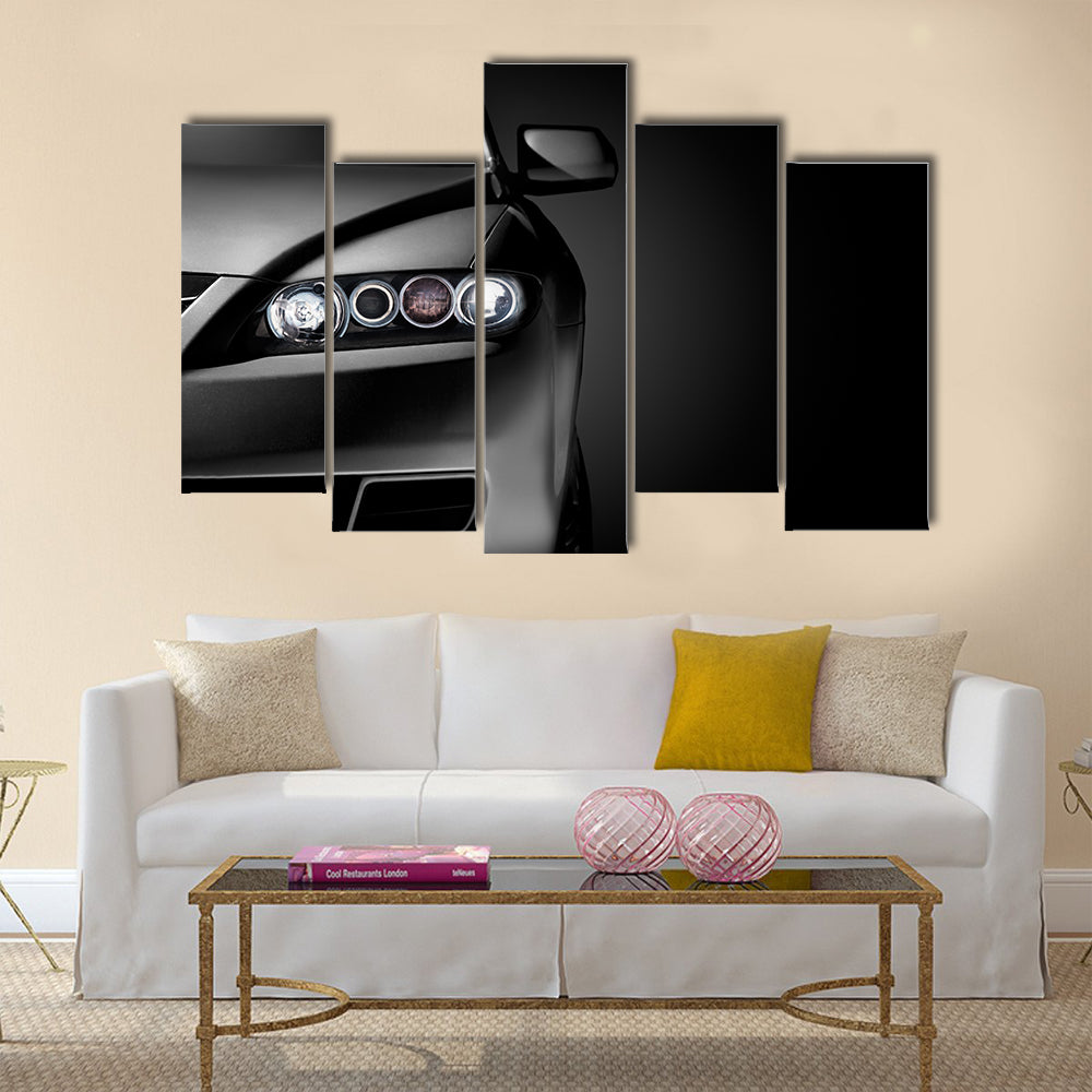 Gray modern car closeup on black background Multi panel canvas wall art