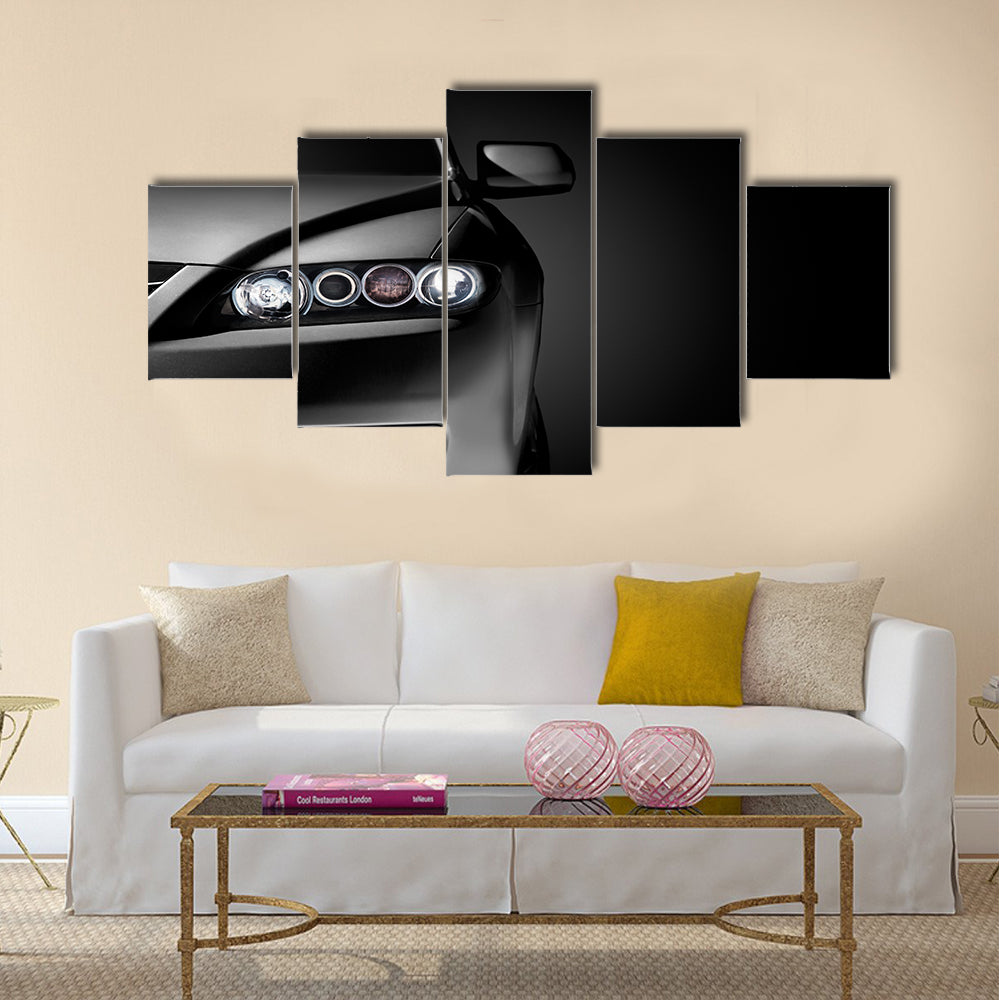 Gray modern car closeup on black background Multi panel canvas wall art