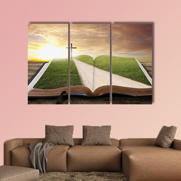 An open Bible with a road and grassy field leading to a cross multi panel canvas wall art