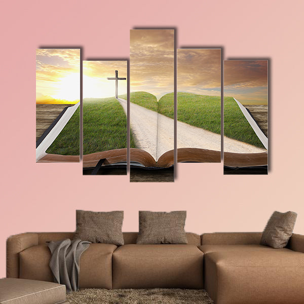 An open Bible with a road and grassy field leading to a cross multi panel canvas wall art