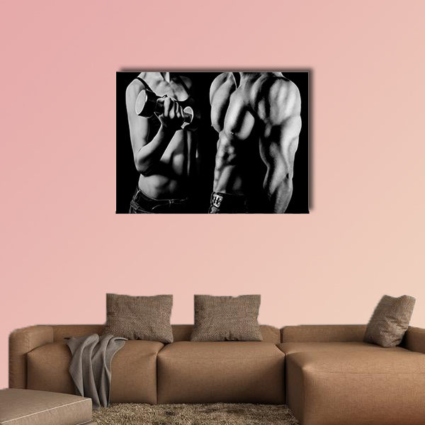 Bodybuilding strong man and a woman posing on a black background Multi panel canvas wall art