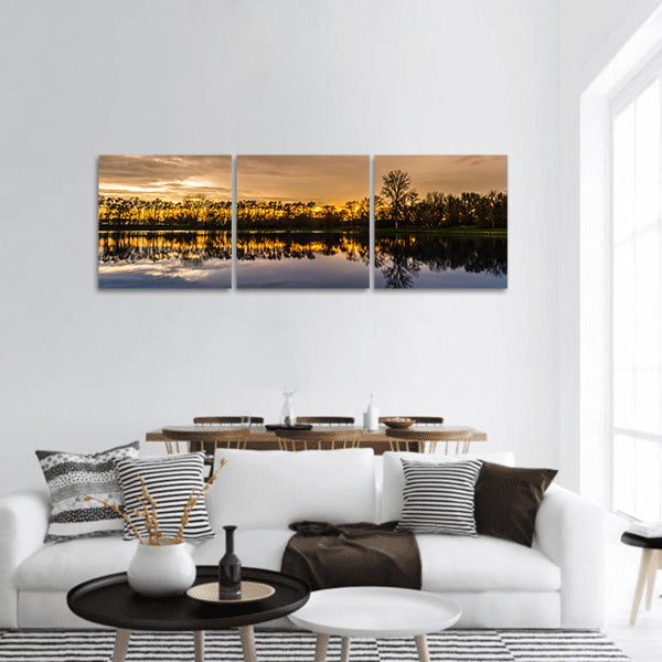 Sunset with a reflection over a small lake in Illinois Panoramic Canvas Wall Art