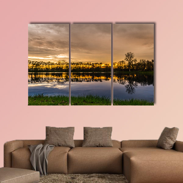 Beautiful sunset with a reflection over a small lake in Illinois Multi panel canvas wall art