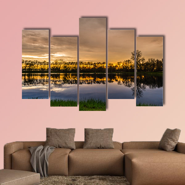 Beautiful sunset with a reflection over a small lake in Illinois Multi panel canvas wall art