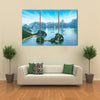 Tourist junks floating among limestone rocks at early morning in Southeast Asia Multi panel canvas wall art