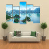 Tourist junks floating among limestone rocks at early morning in Southeast Asia Multi panel canvas wall art