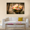 Heaped rustic bowl of savory quinoa with herbs, peppers and tomato Multi panel canvas wall art