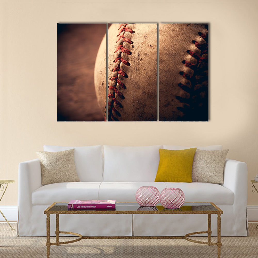 Old baseball on wooden background and highly closeup Multi panel canvas wall art