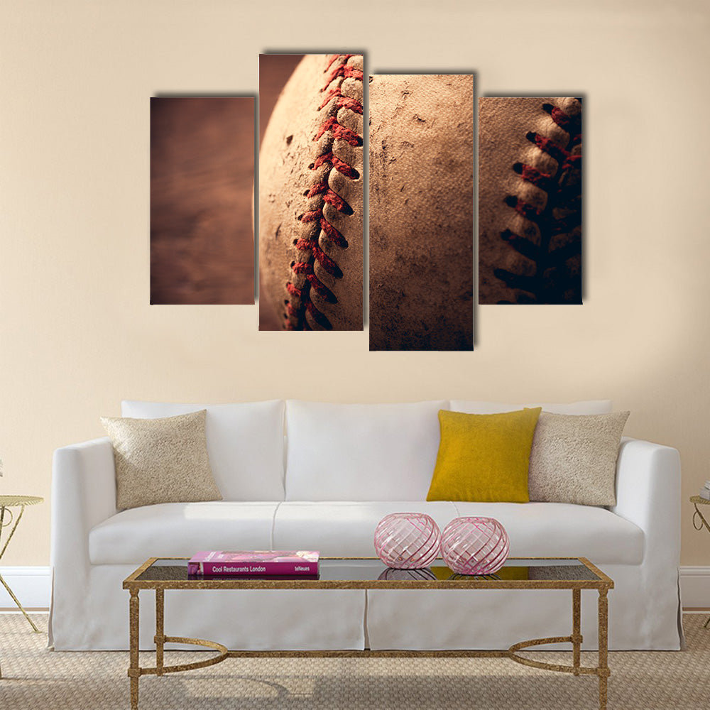 Old baseball on wooden background and highly closeup Multi panel canvas wall art