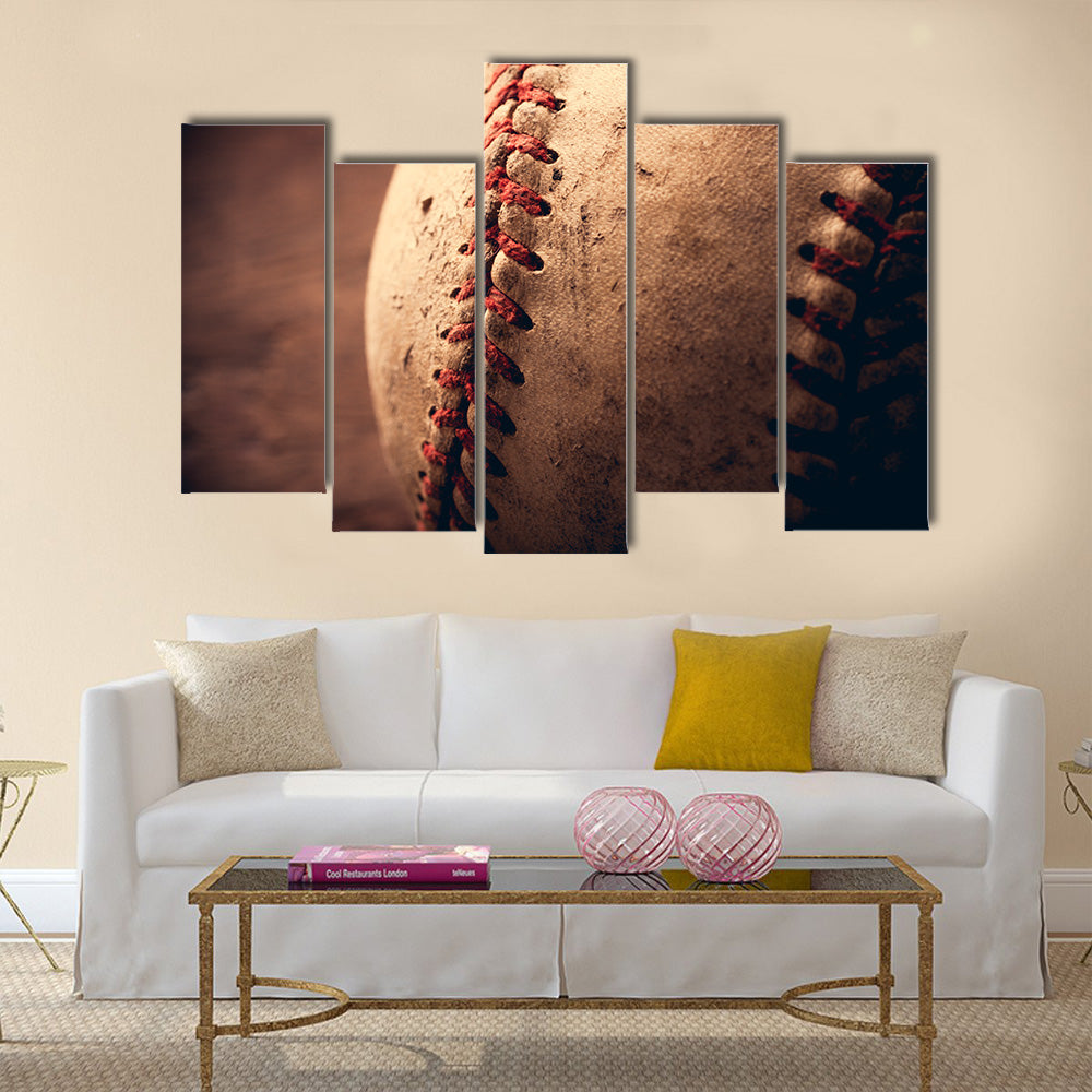 Old baseball on wooden background and highly closeup Multi panel canvas wall art