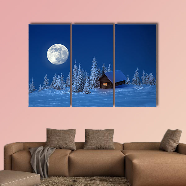 A wooden house in winter forest multi panel canvas wall art