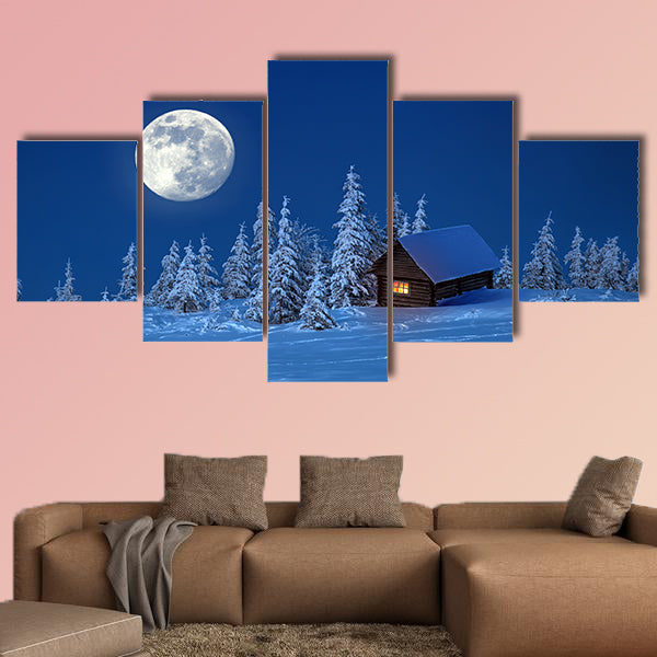 A wooden house in winter forest multi panel canvas wall art