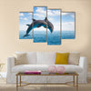 Two jumping dolphins, seascape with deep ocean waters and cloudscape Multi Panel Canvas Wall Art